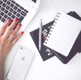 woman-hand-smartphone-desk